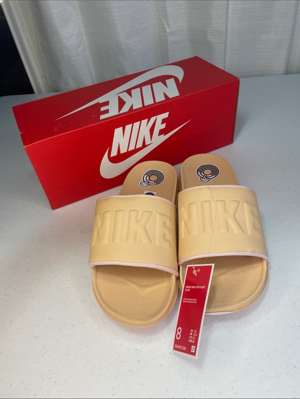 Nike women’s Peach/Tan Slide Sandals